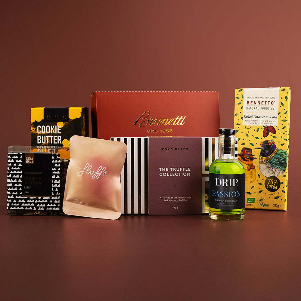 Assorted gourmet hamper with cookie butter, chocolate, truffle collection, coffee drip jar, and grissini breadsticks in.